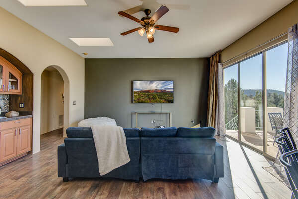 Family Room with a Smart TV and Deck Access