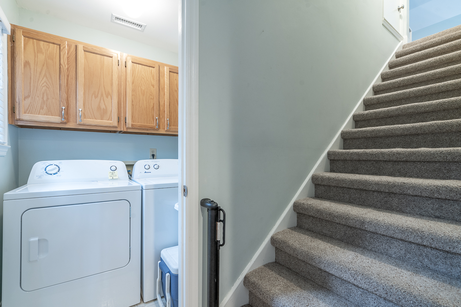 Laundry Room + Stairs Leading to Upstairs Loft