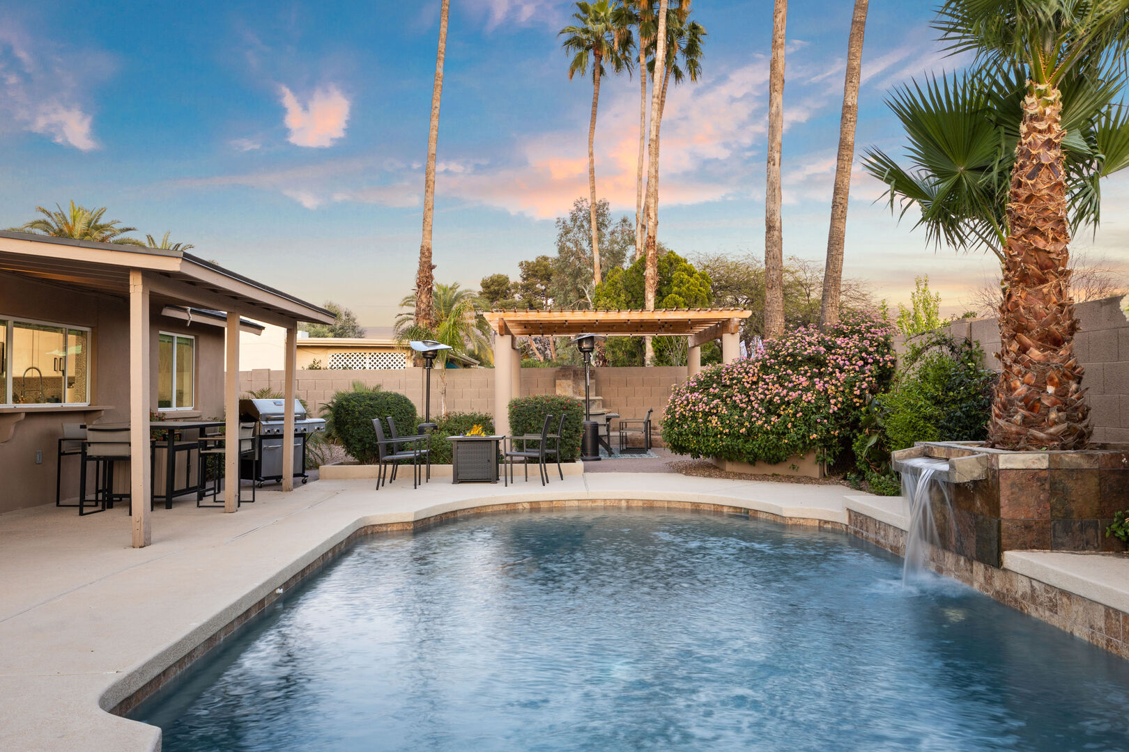 Beautiful Outdoor Pool Area with Neighboring Palms