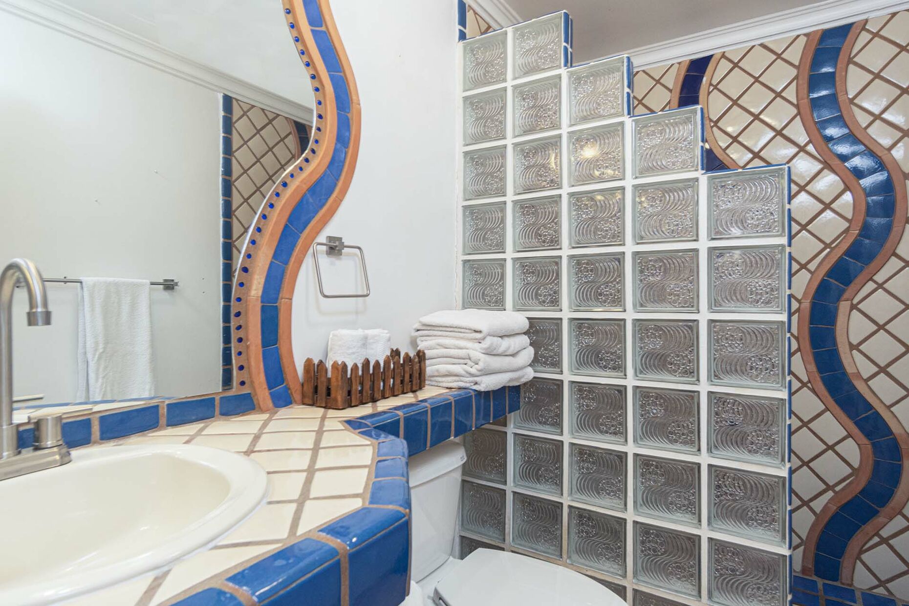 the tile lined guest bathroom