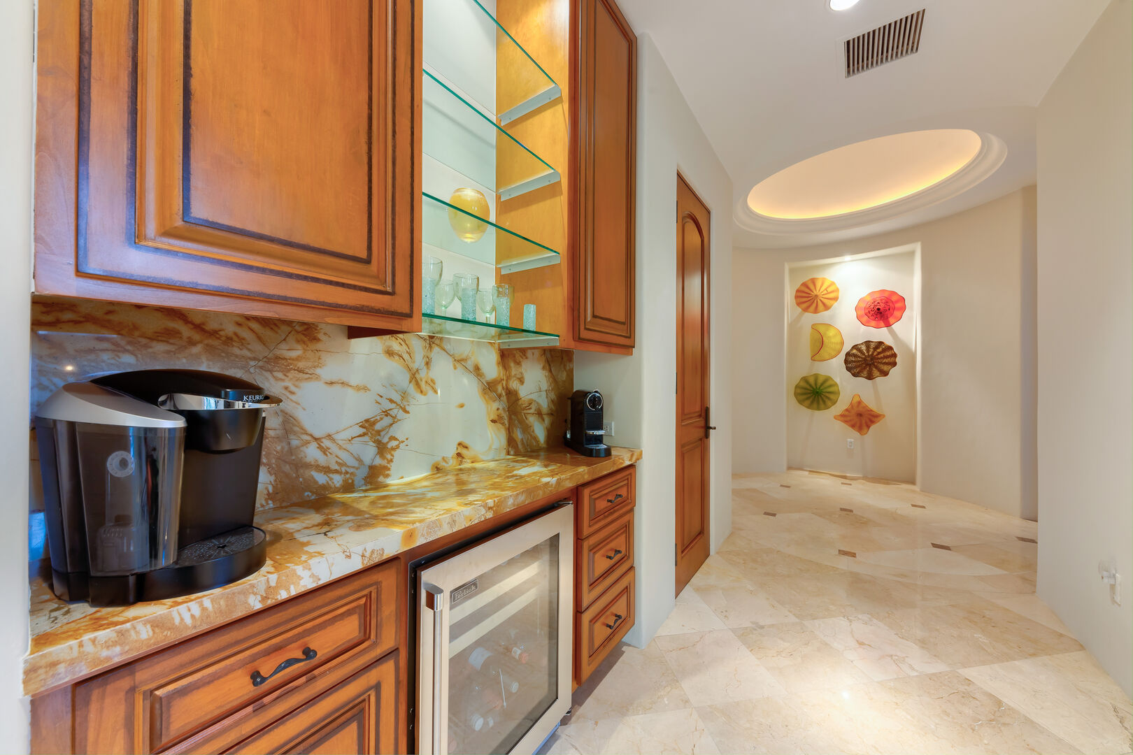Kitchen with a wine cooler and a coffee maker