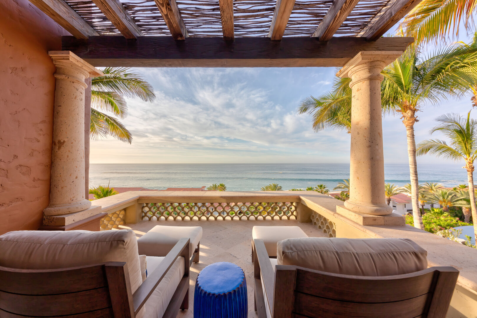Balcony with two lounge chairs and ocean views
