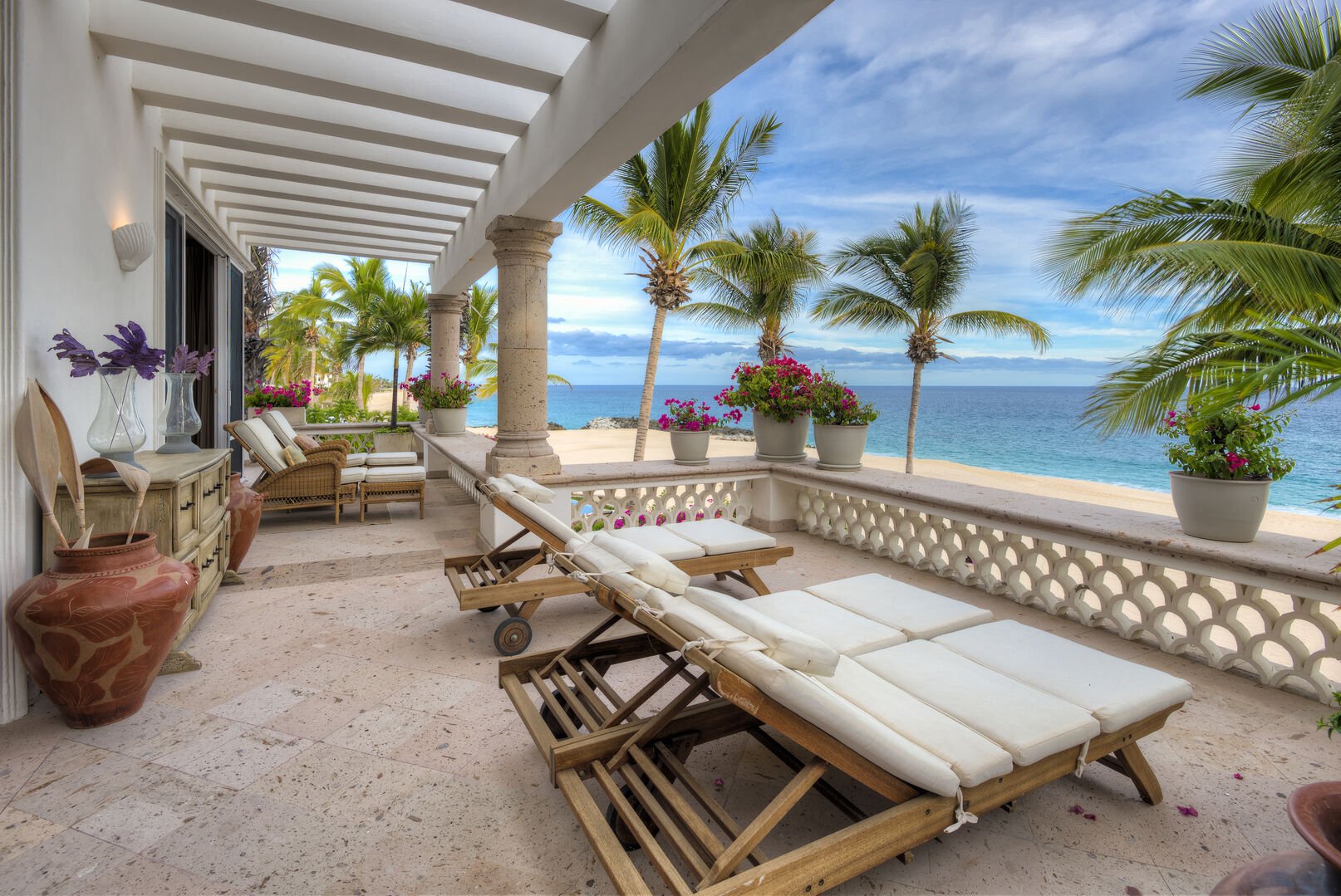 Large beachfront balcony with chaise lounges