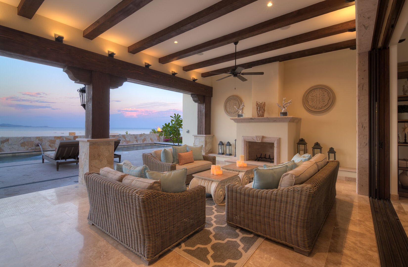 Outdoor Lounge Area with Fireplace at Casa Bella Villa