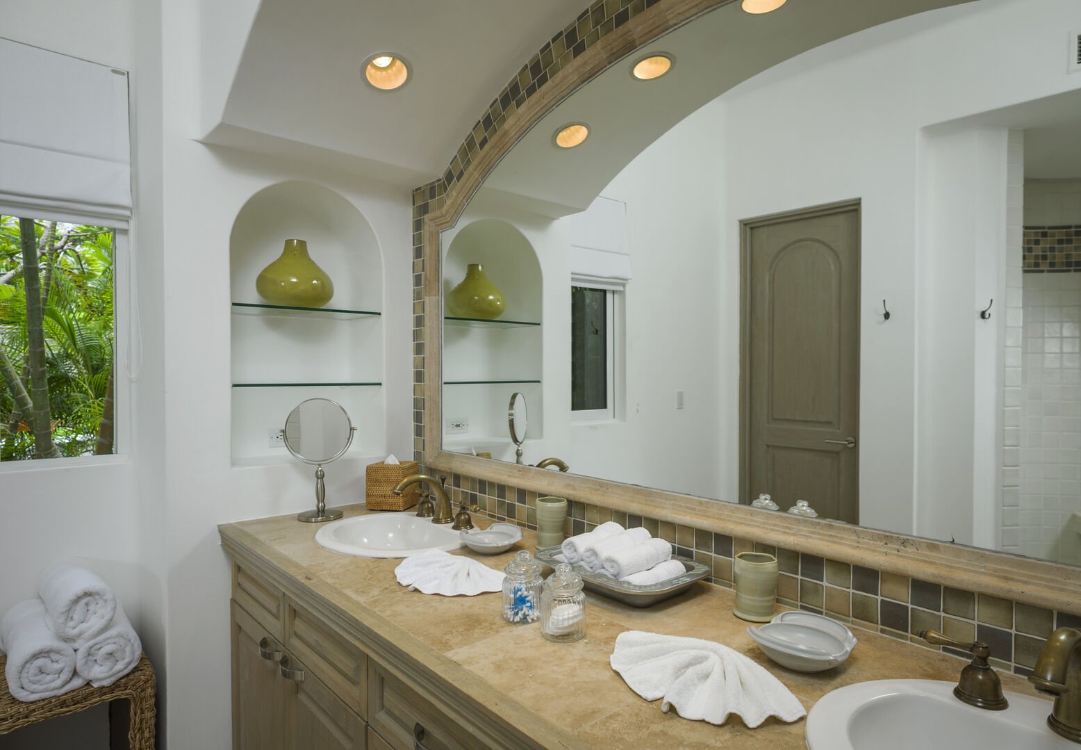 A palatial vanity unit for two and white towels