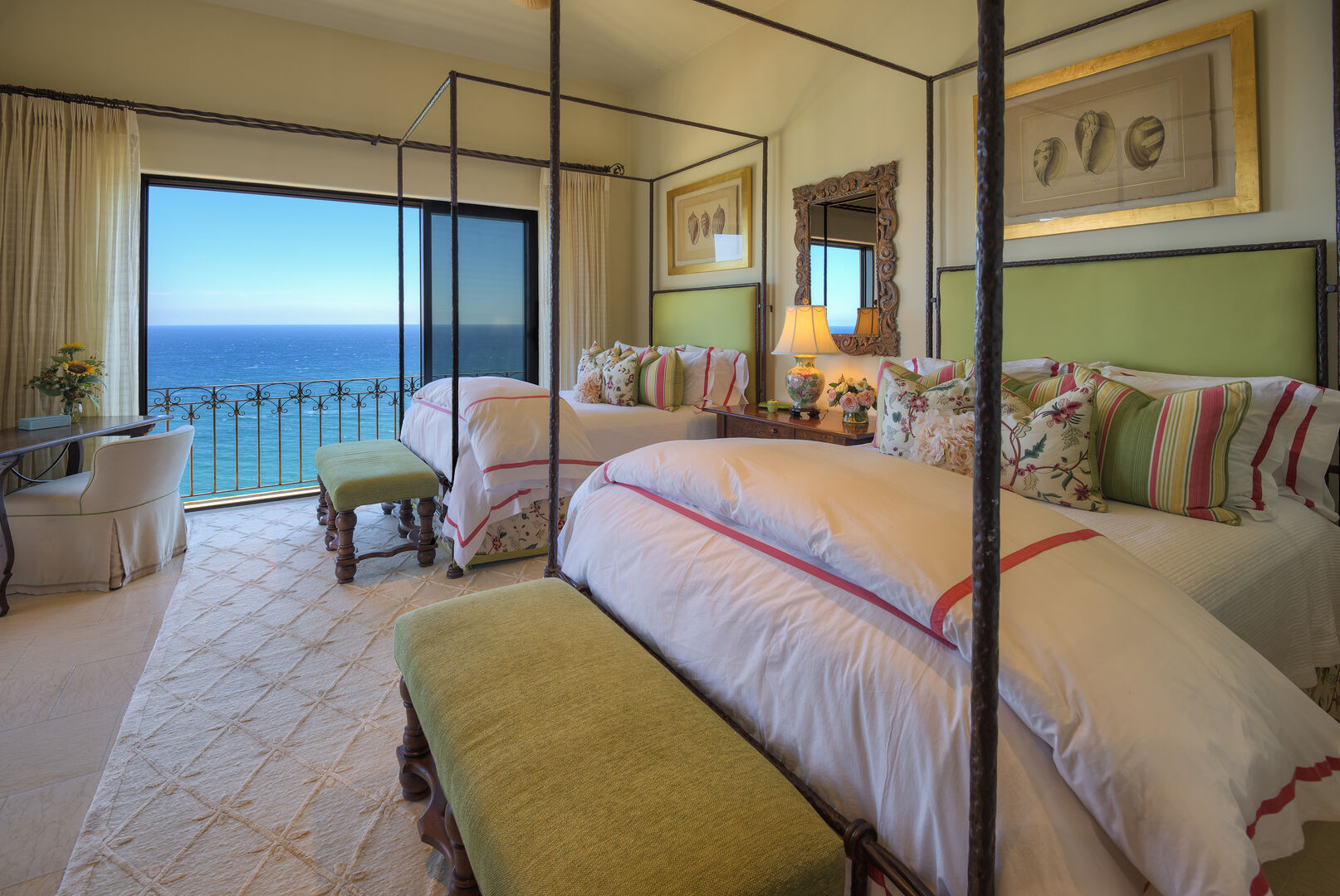 Bedroom with two green beds and ocean views