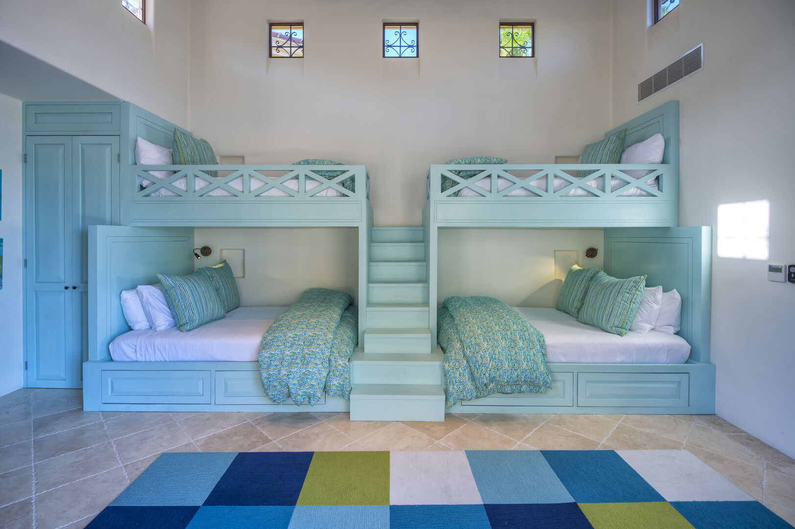 A bedroom with twin bunk beds inside the Epiritu Casita 1