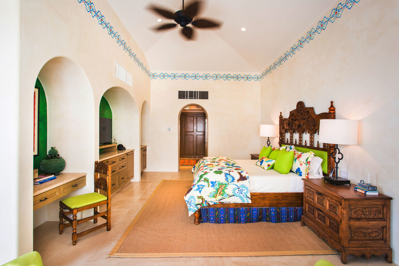 Bedroom with ceiling fan and high ceilings