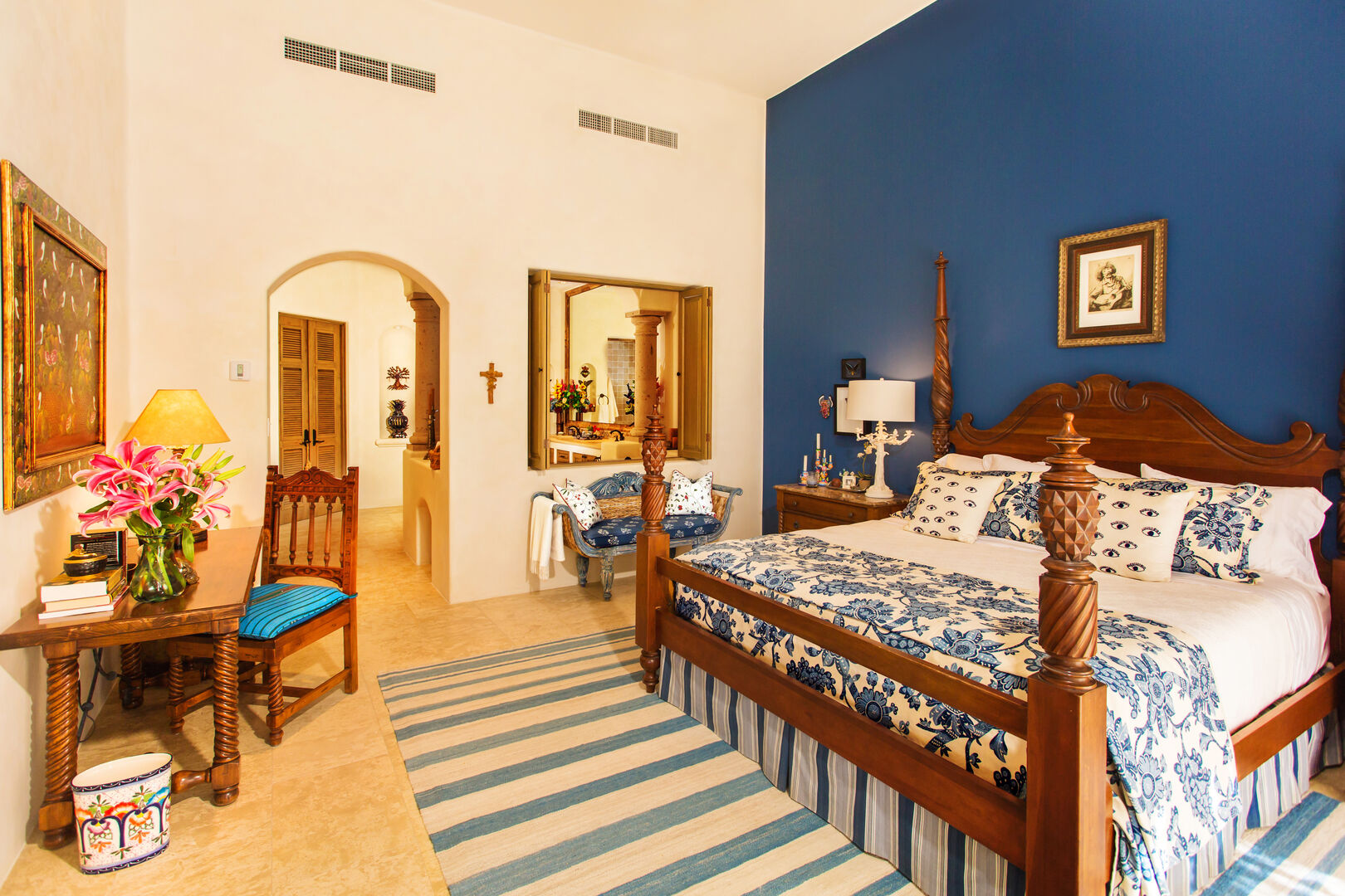 This villa in Los Cabos Mexico features a bedroom with blue walls and large bed