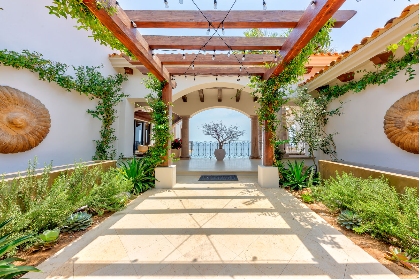 A covered walkway with an ocean view at Hacienda 502