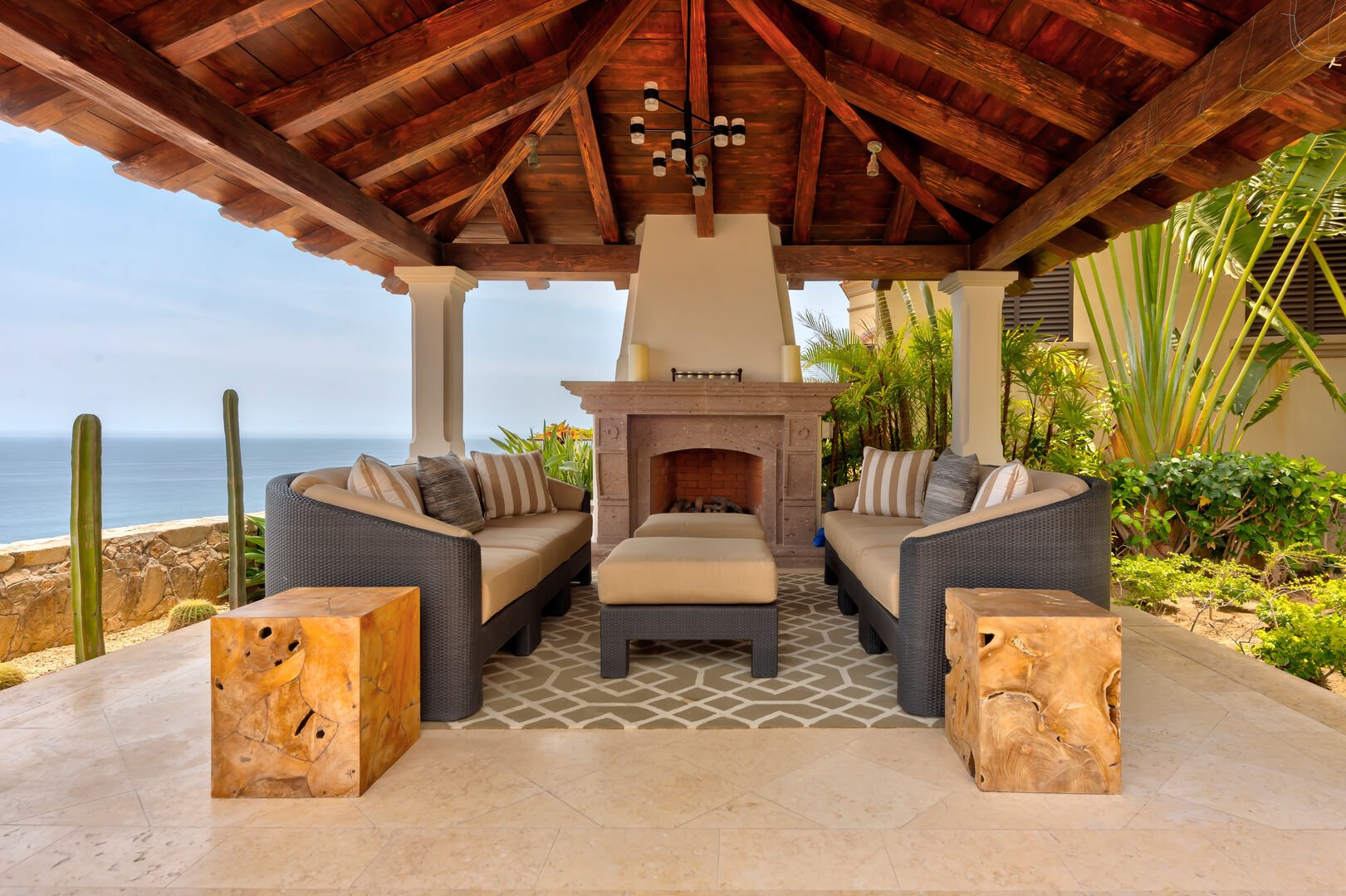 The covered outdoor fire place and seating area at Hacienda 502