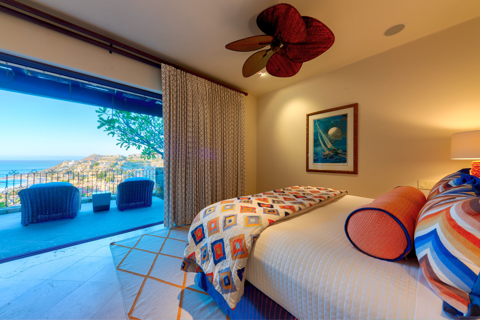 A bedroom with a patio and ocean view at the Espiritu Casita 101