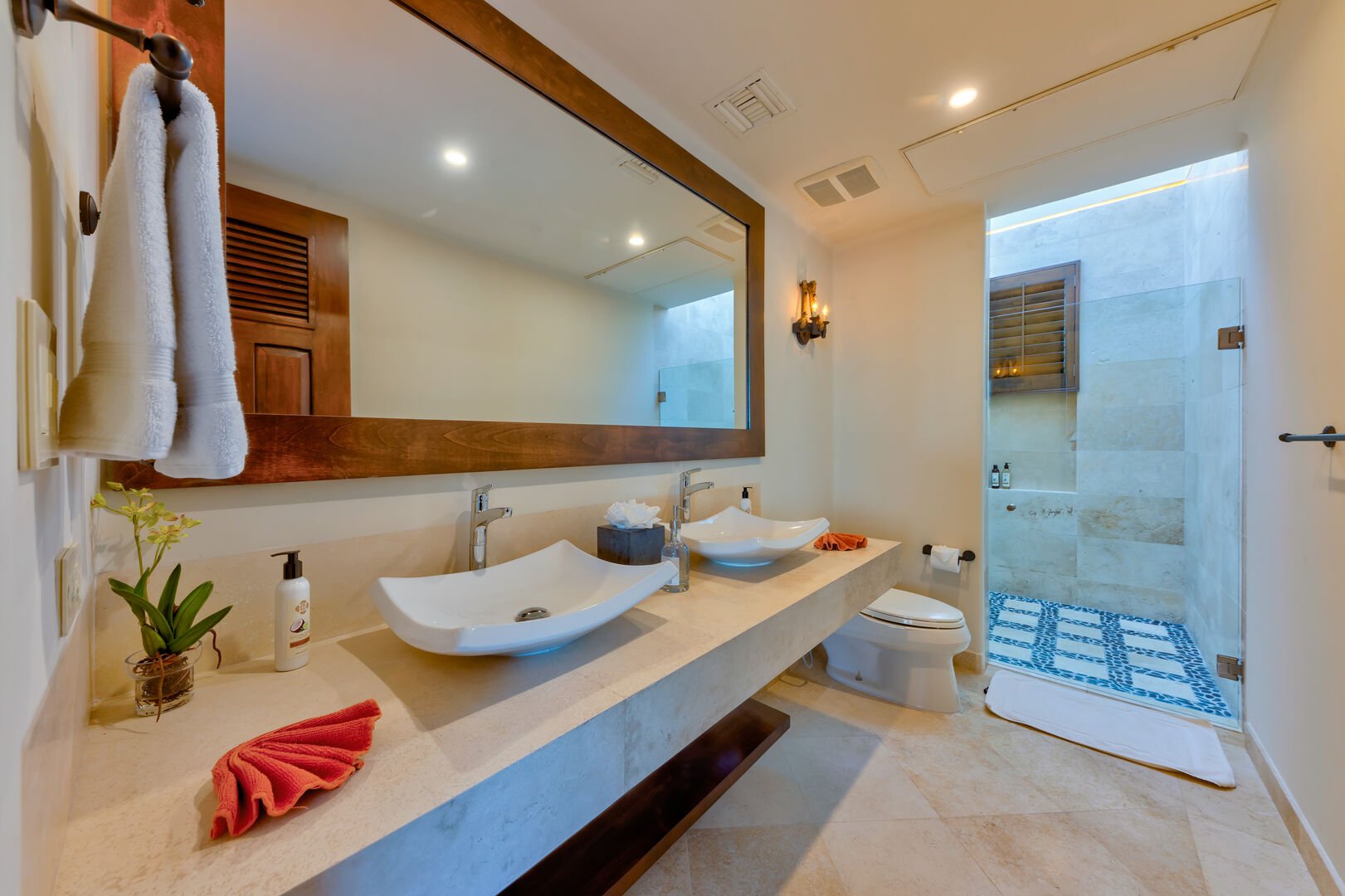 An en suite bathroom with a shower and sink at the Espiritu Casita 101