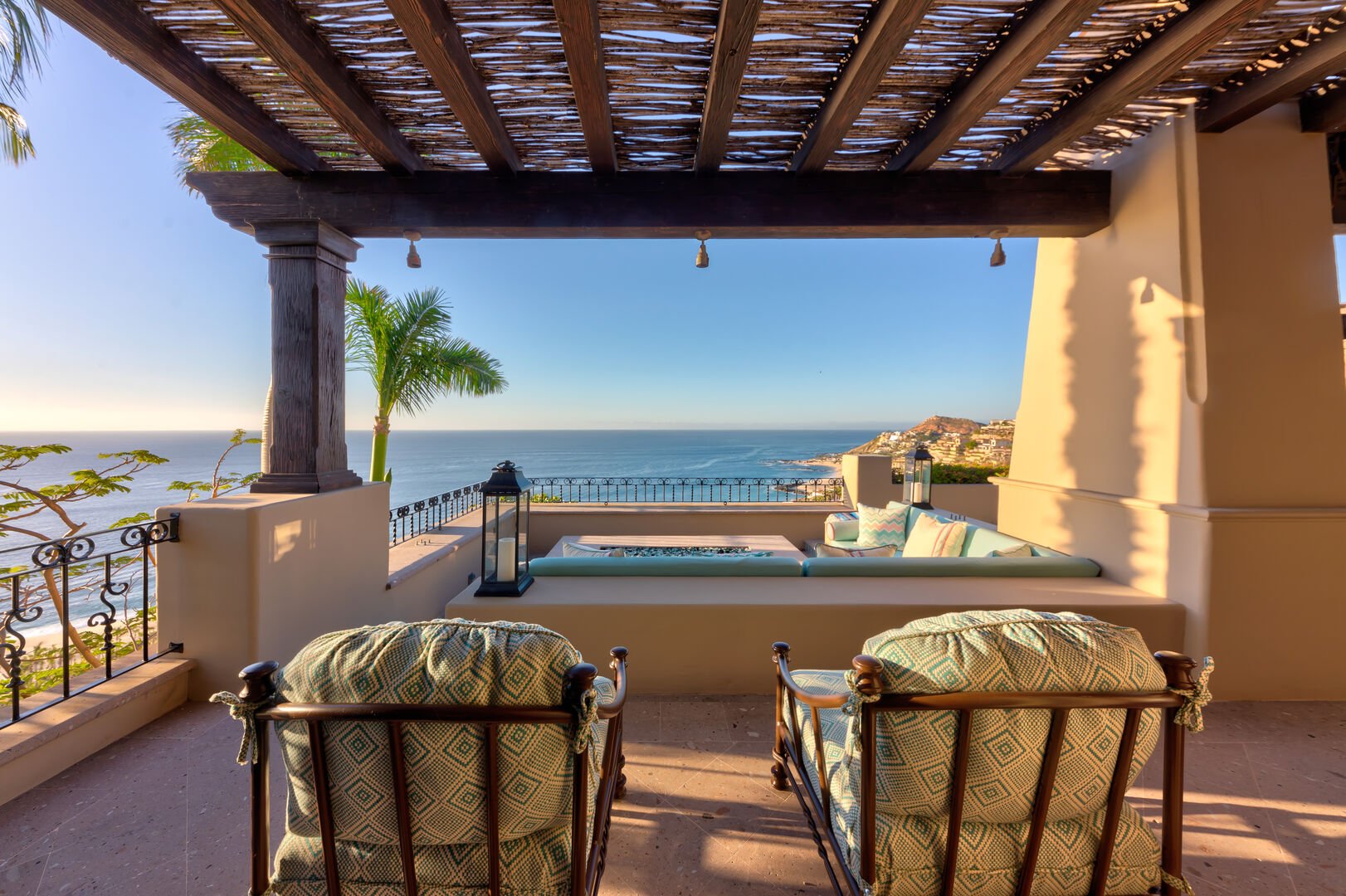 A patio with chairs and an ocean view at the Espiritu Casita 101
