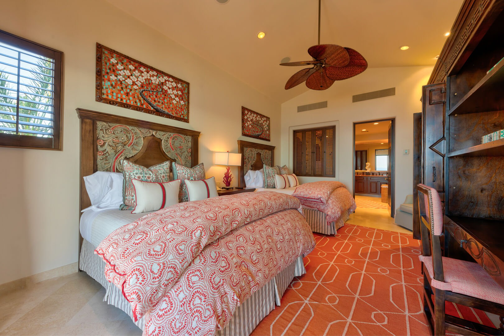 A bedroom with two beds and an en suite bathroom at the Espiritu Casita 101