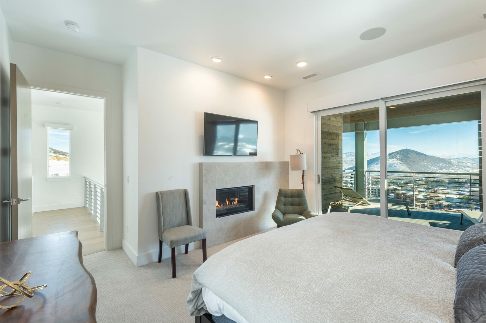 Master bedroom with mountain view and private balcony.
