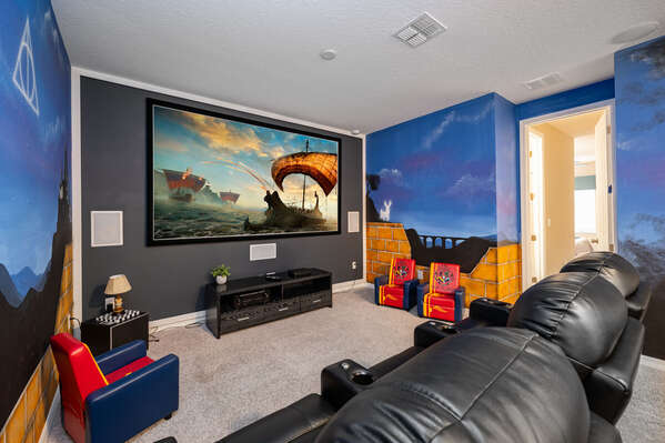 Loft movie room with huge projection TV screen with surround sound