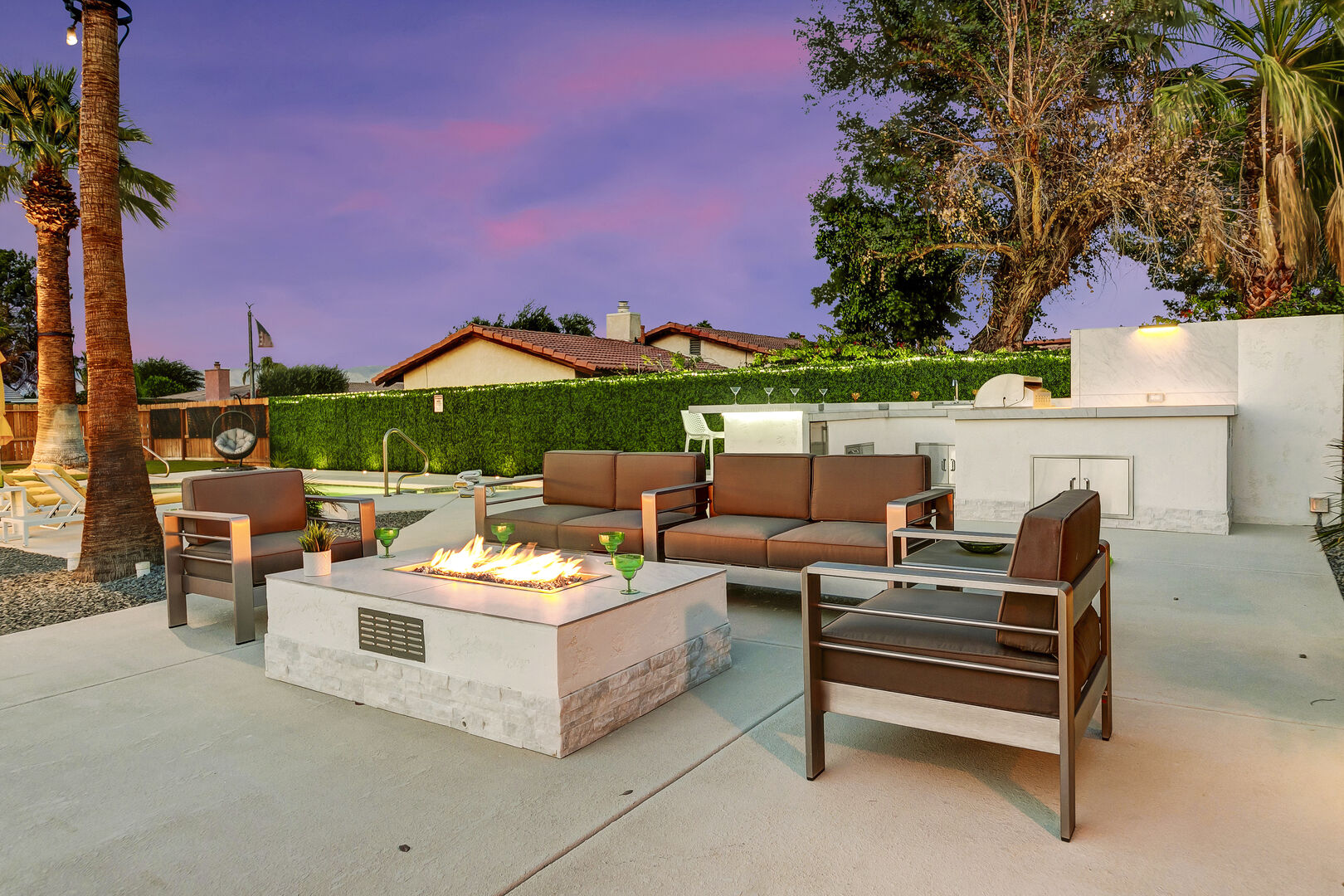 Gather around the fire pit with seating for six.