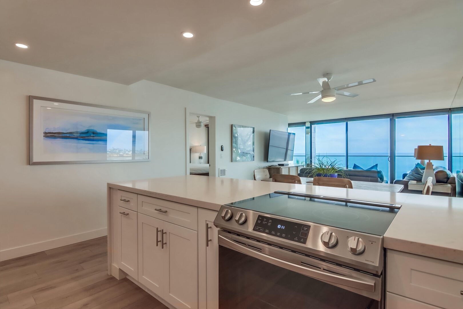 Quartzite countertops and stainless steel appliances. Cook meals at home with views of the ocean!