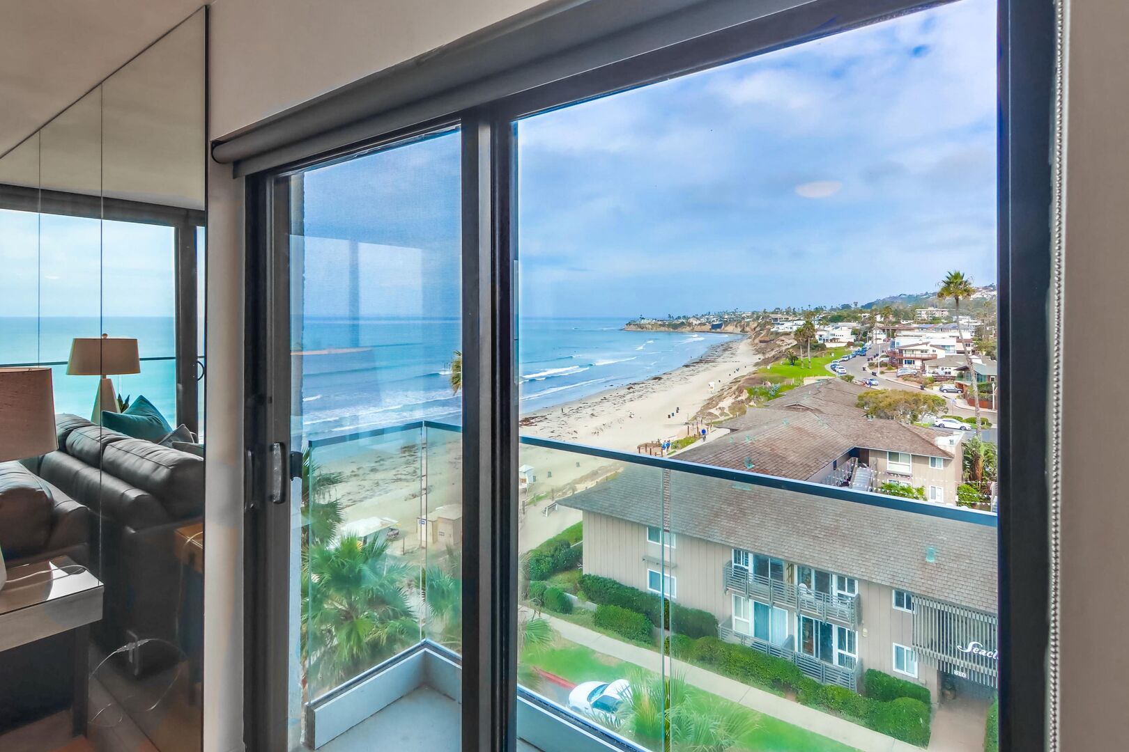 Side views from the dining room with this corner unit of North Pacific Beach and La Jolla! Blinds can be adjusted by a pulley chain. All sliding glass doors have a screen and lock.