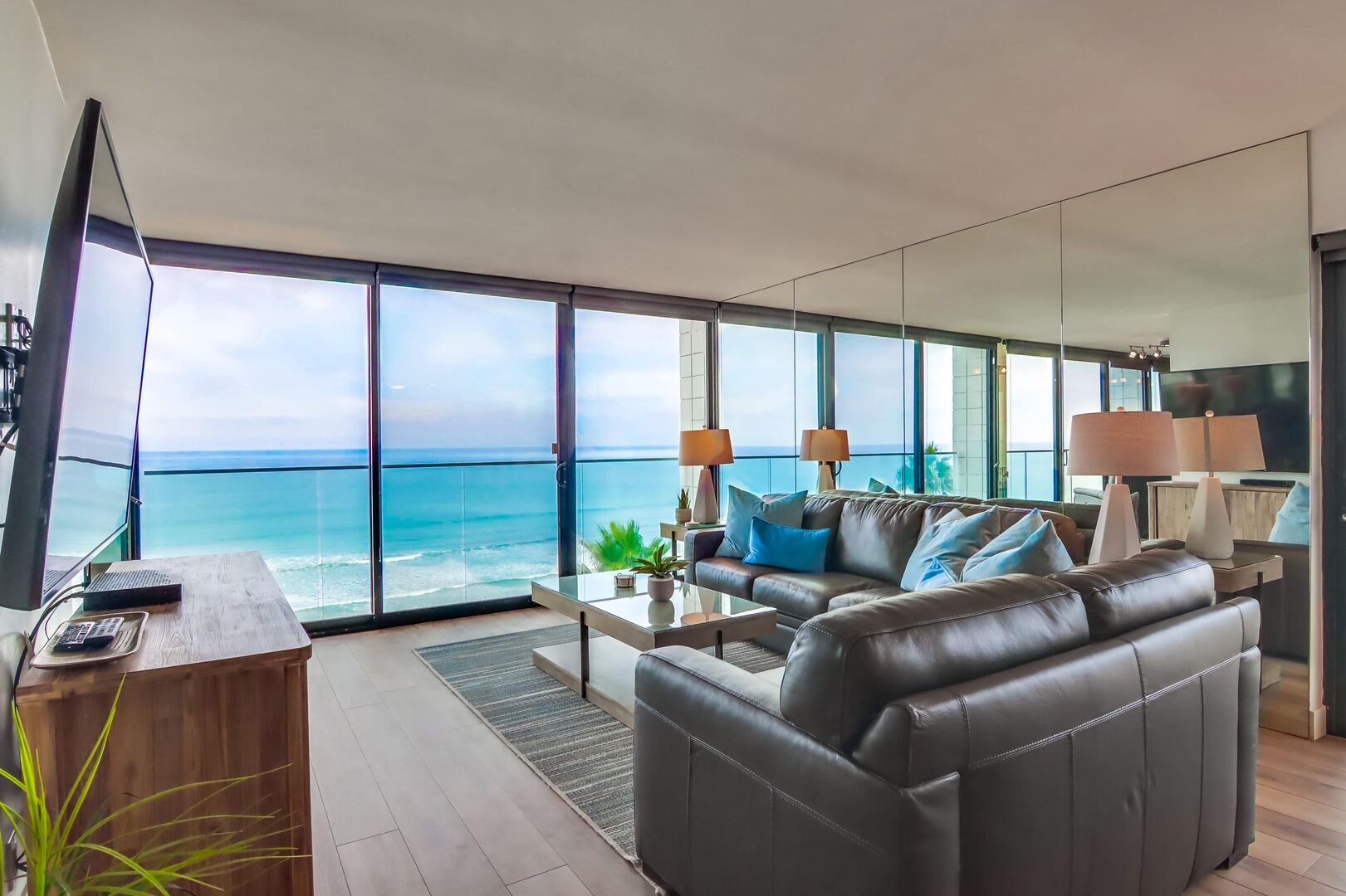 Living room with ceiling to floor incredible ocean views!