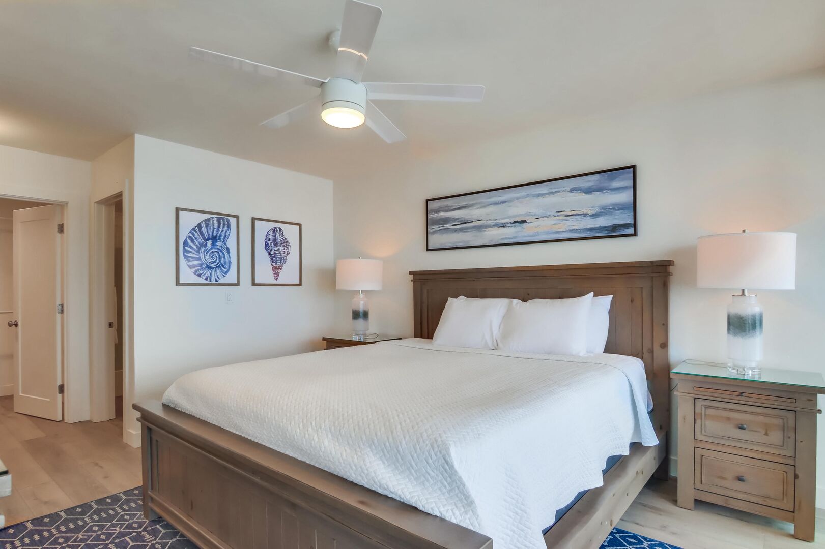 Master bedroom with overhead light/fan, 2 closets (one walk-in) and in-suite bathroom