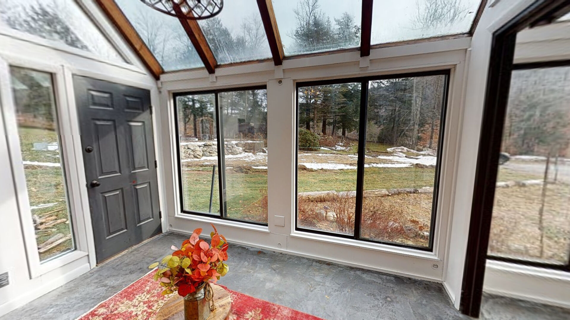 Sunroom with small free standing fireplace