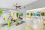 There is plenty of room in the living room to lounge in comfort under the remote-controlled ceiling fan.
