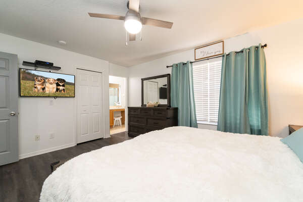 Master bedroom showing bathroom and TV