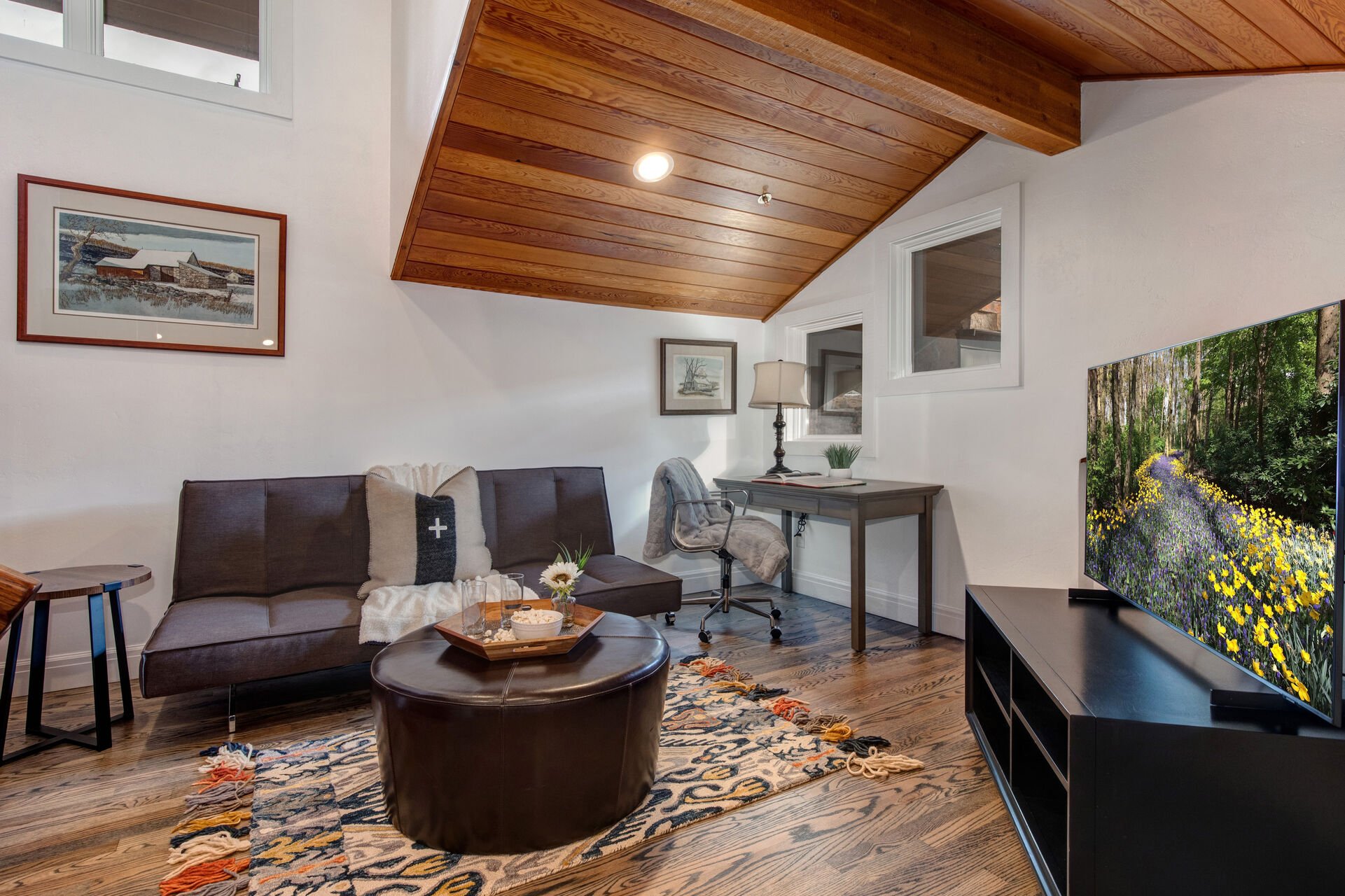 Loft Area with Samsung smart TV, work desk, and futon