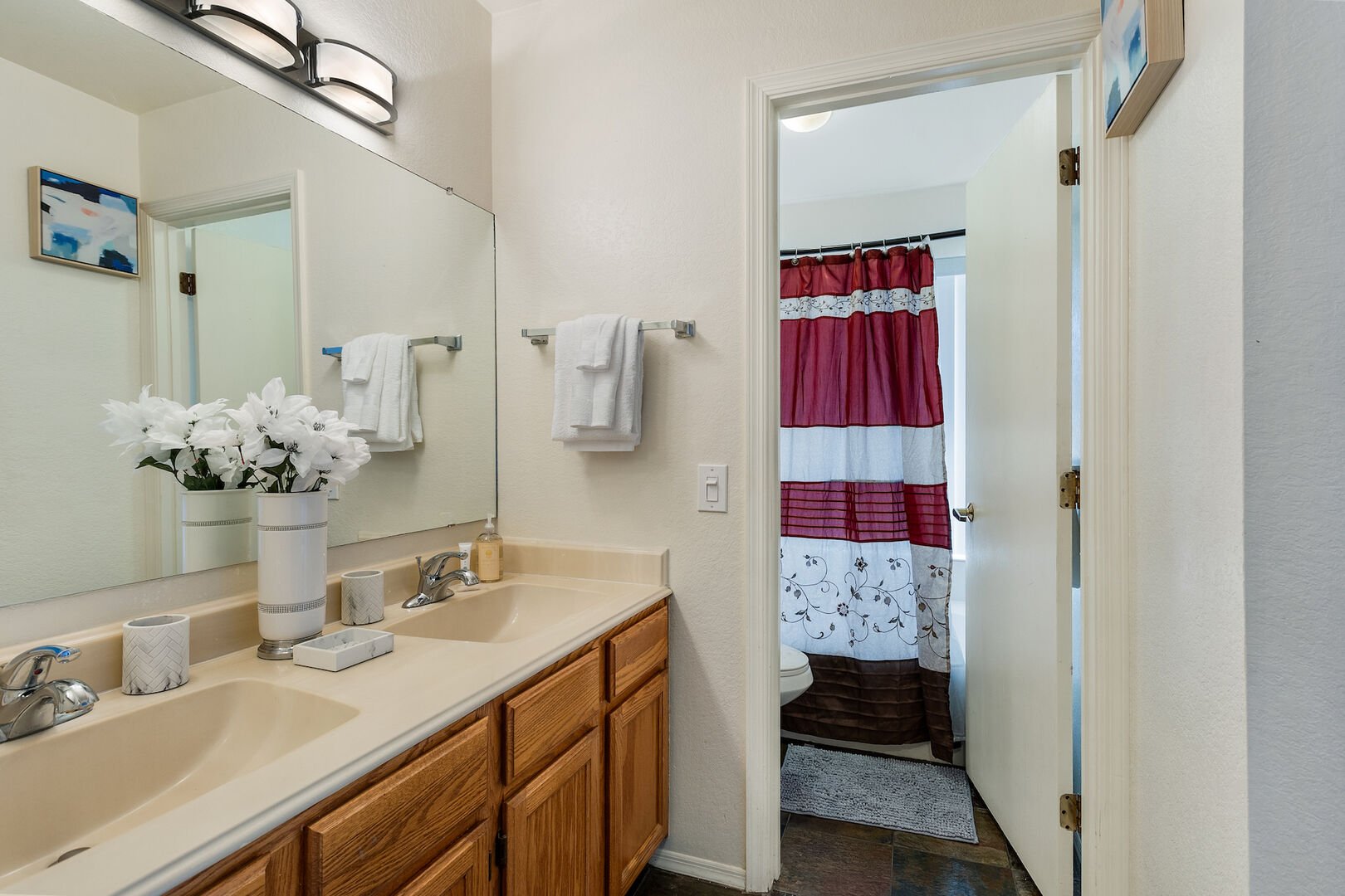 Guest Bath with Jack & Jill Sinks and a separated shower/toilet for convenient use by two people!