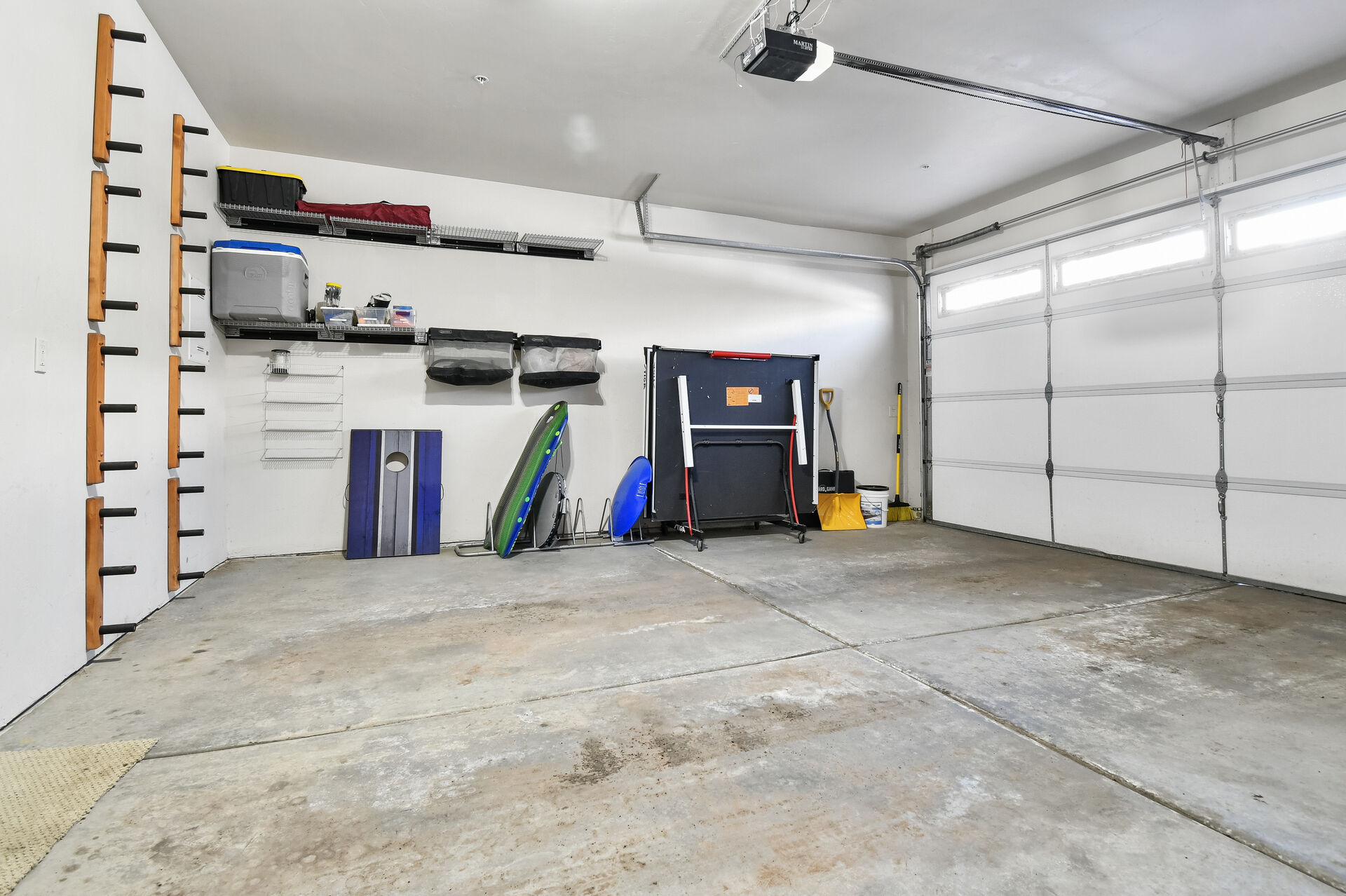Large 2 car garage with Ping Pong table, dart board, and ski rack