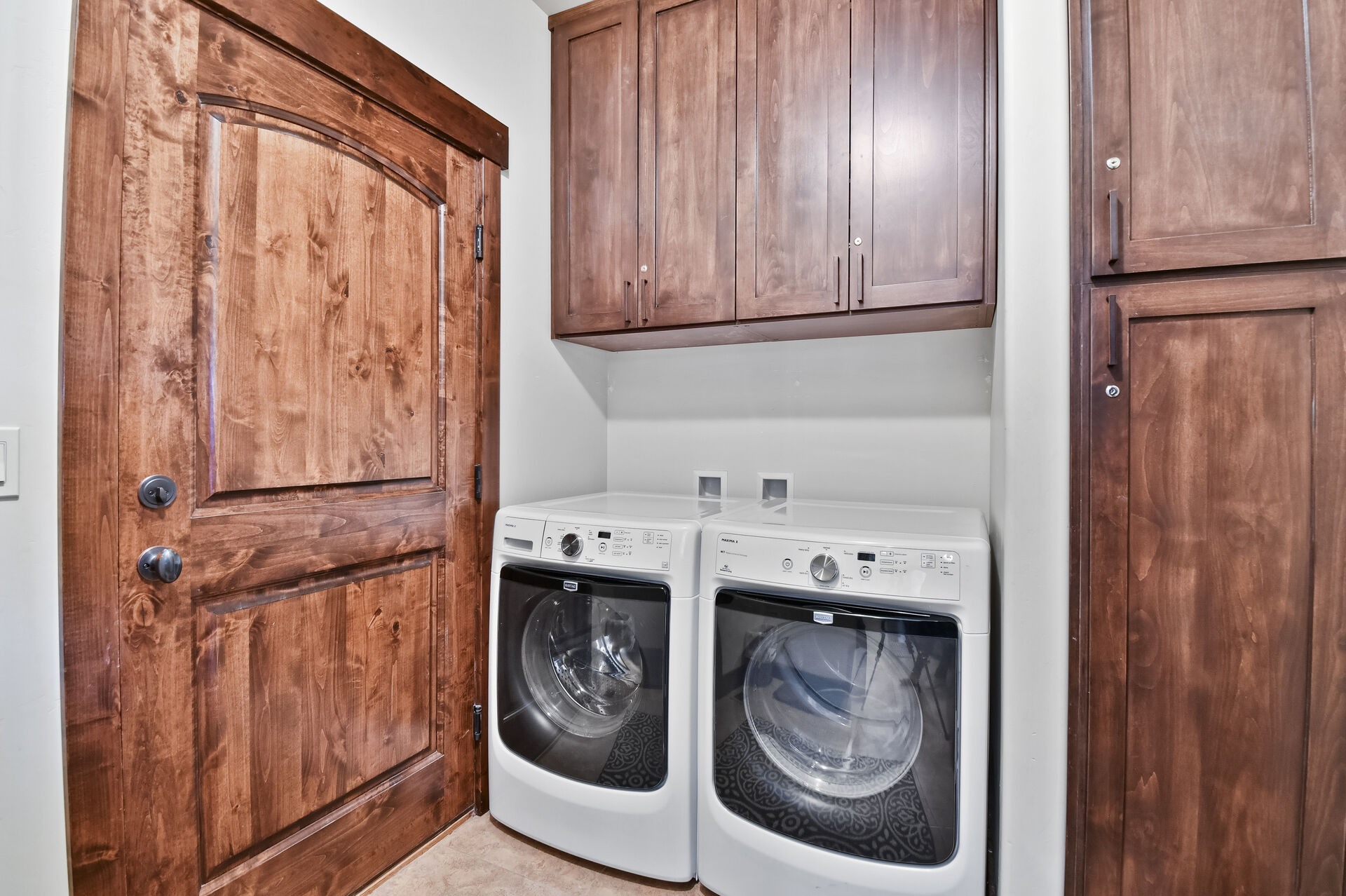 Washer and Dryer room with extra supplies