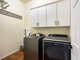 Laundry room with storage, washer and dryer