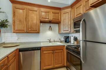 Completely furnished kitchen with stainless steel appliances