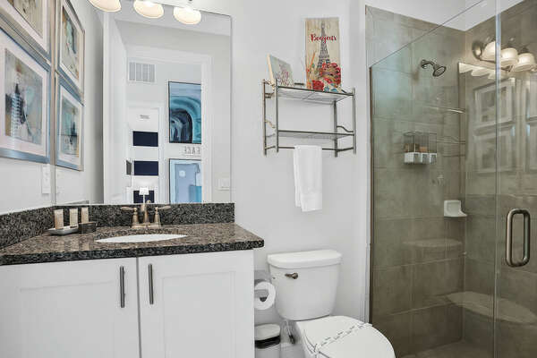 This full bath with shower is located conveniently across the hall