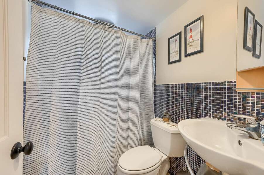 Bathroom #1 with tub shower combo at 60 Lyman Lane-South Yarmouth-Cape Cod