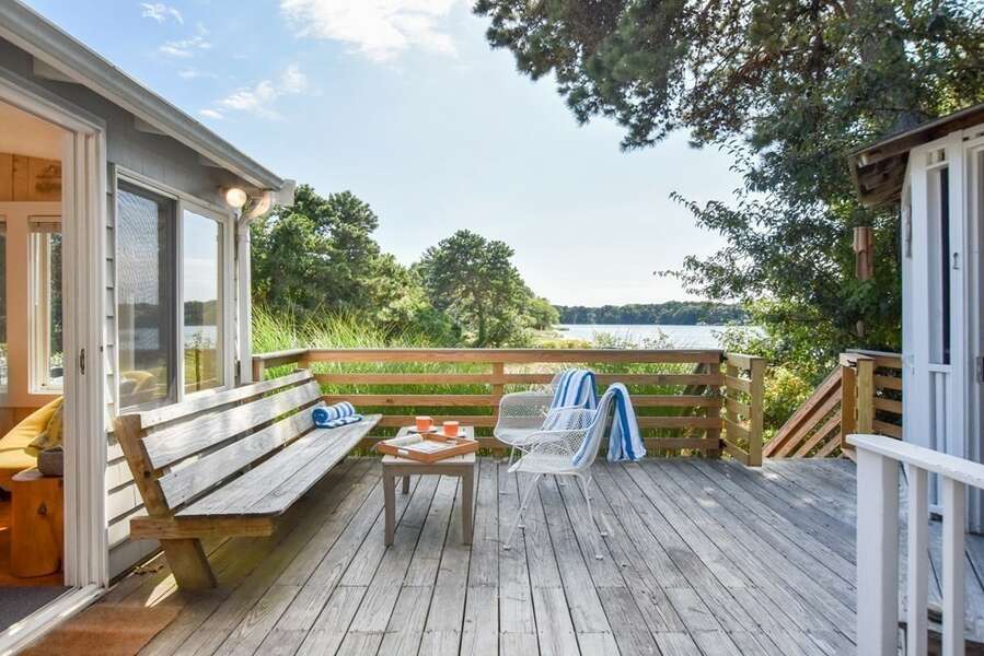 Enjoy the views of the salt water pond from deck at Bass Cove Compound-24 Follins Pond-Dennis-Cape Cod