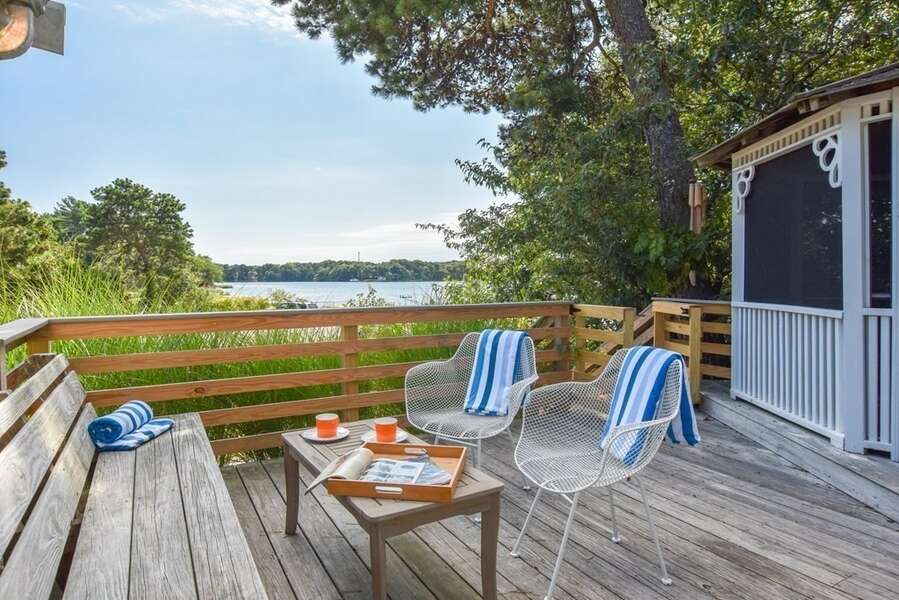 End the day with a cocktail on the deck as you watch the sun set - Bass Cove Compound-24 Follins Pond-Dennis-Cape Cod