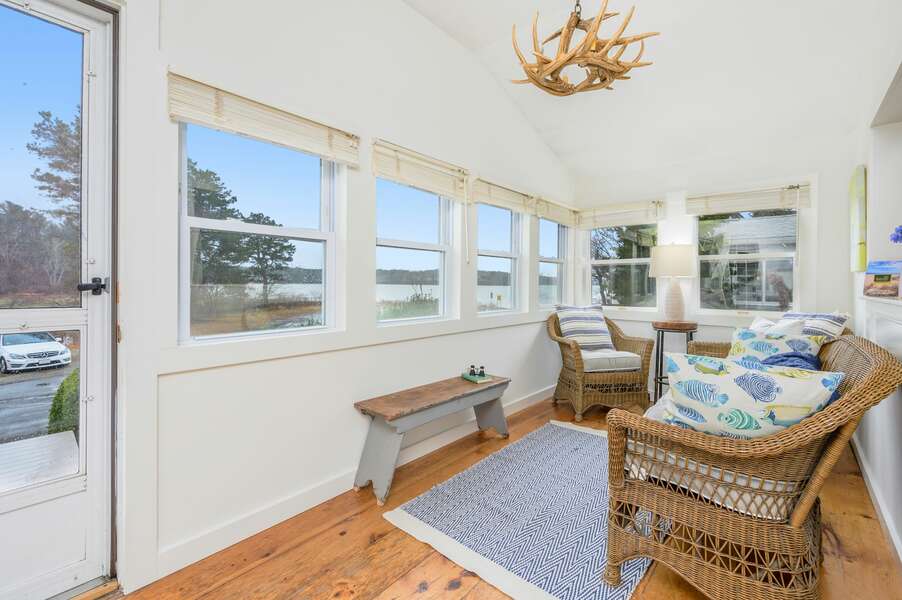 Sunroom with a view of the salt water pond - Bass Cove Compound-22 Follins Pond- Dennis-Cape Cod