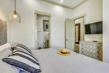 2nd bedroom on Main Level, King bed with private bathroom. Street view