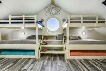 Bunk bedroom upstairs. 2 sets of Queen over Queen bunks with Twin trundles