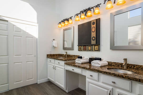 Master Bath with Two Stone Counter Vanities