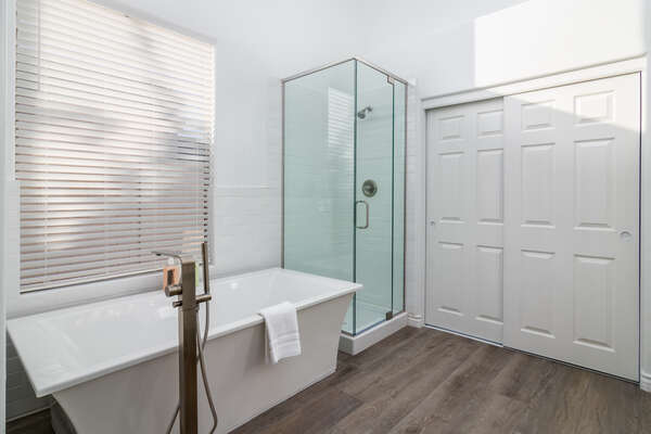 Master Bath with a Soaking Tub and Tile/Glass Shower