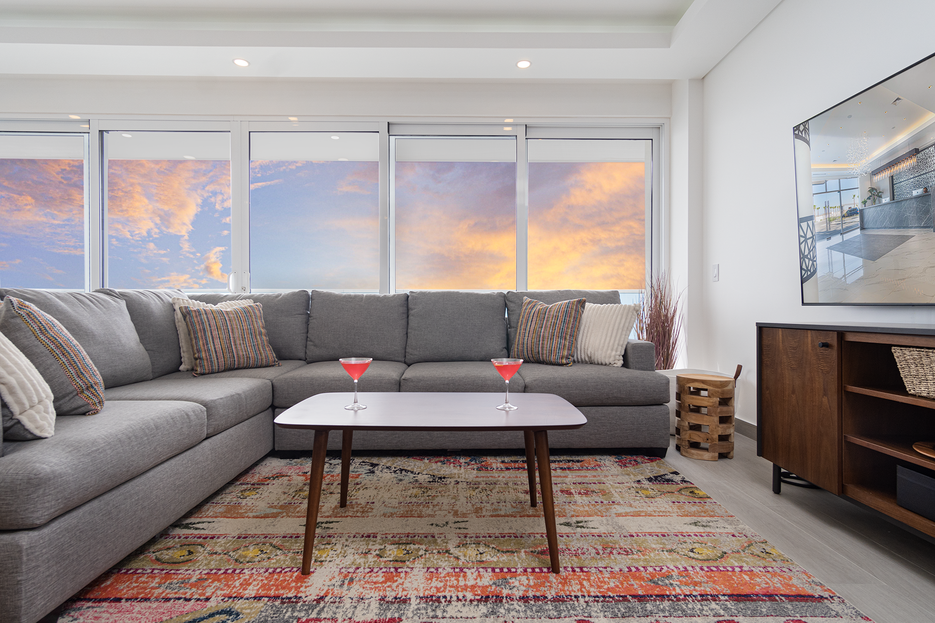 A flaming sunset lights up the living room seating area.