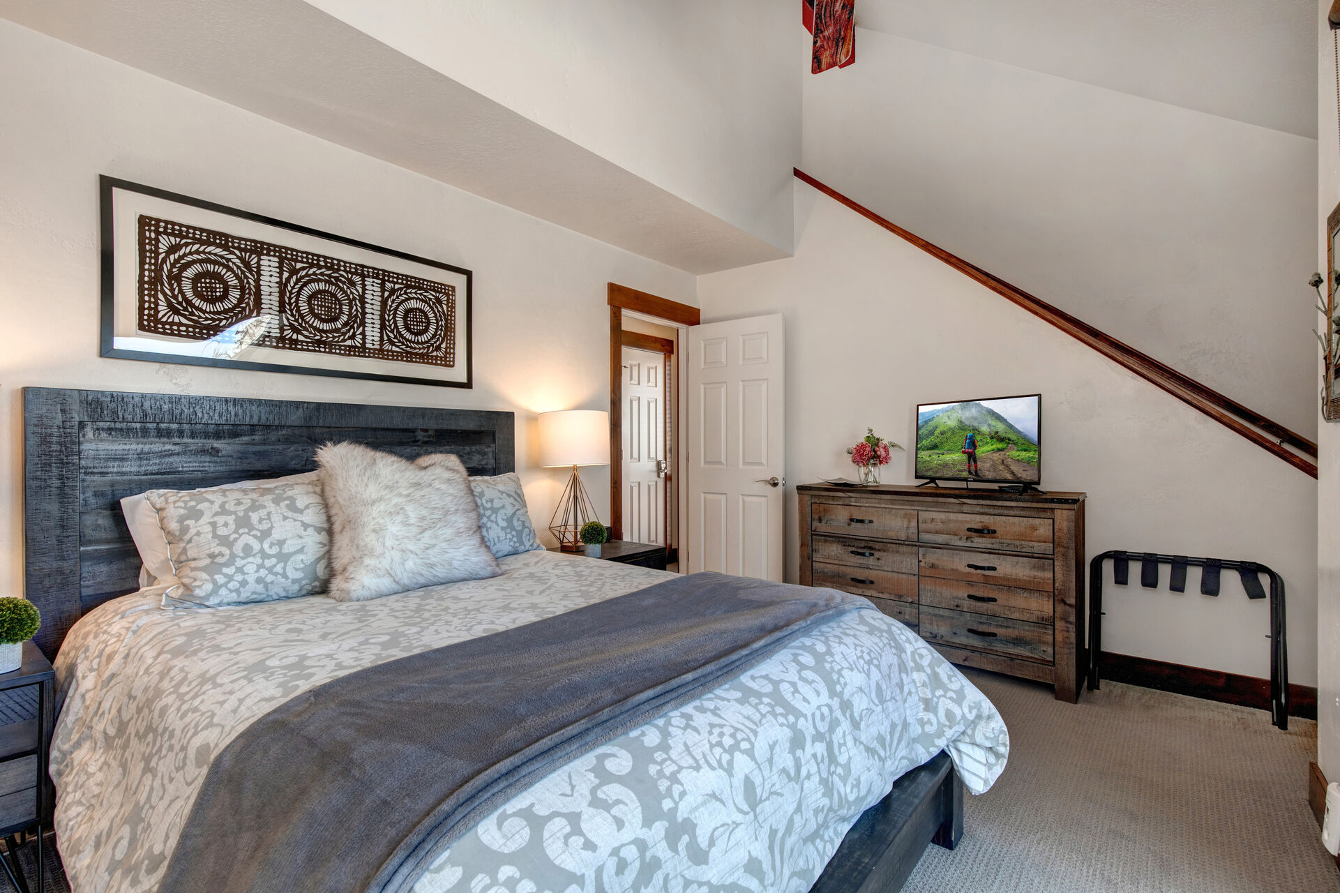 Upper Level Master Bedroom with a Queen Bed and 32