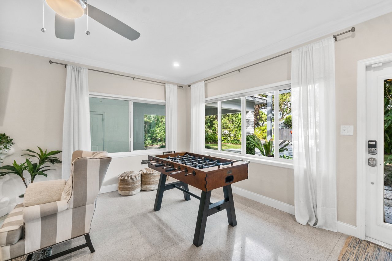 When you first enter the house, you are greeted by the spacious living area. The first thing you'll see is a Foosball table, perfect for those looking for a bit of competition or just casual lighthearted fun!