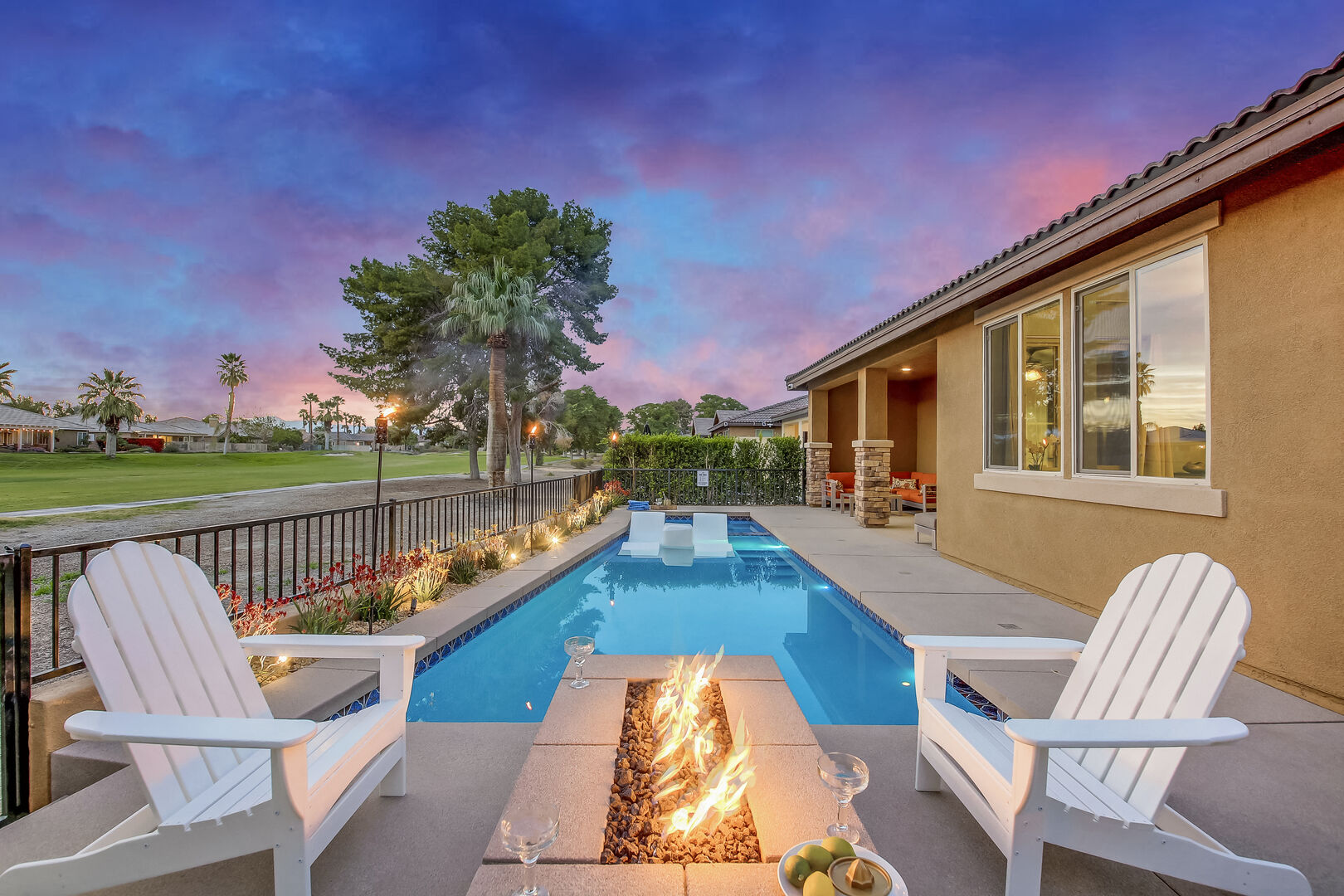 Relax and unwind in this gorgeous backyard with stunning views.