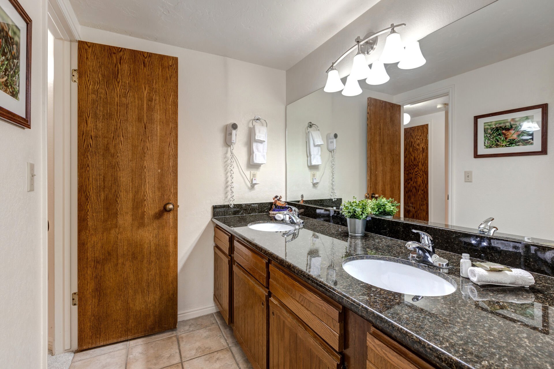 Shared Full Bathroom with double sinks and tub/shower combo