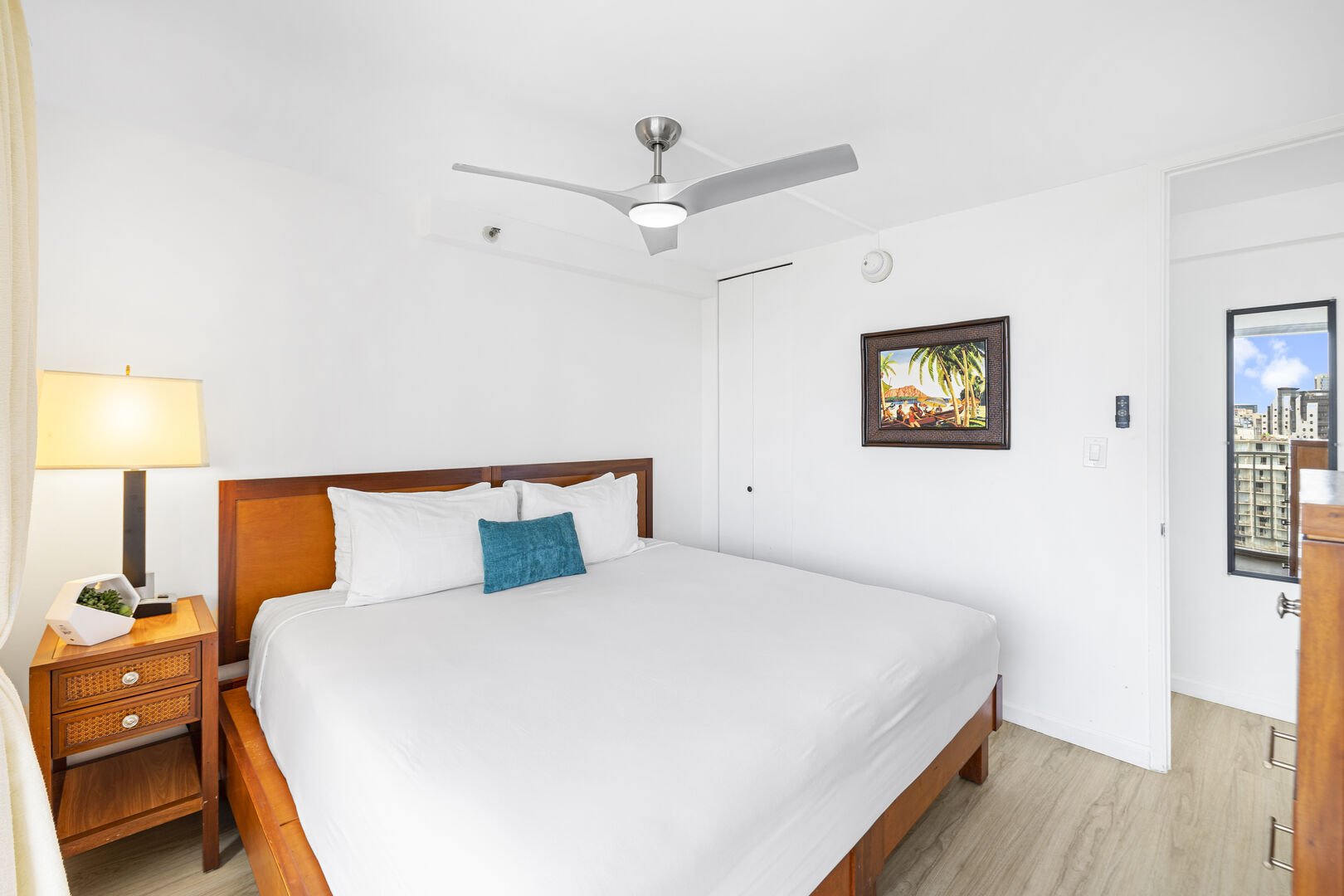 The bedroom features a king-size bed and ceiling fan for your comfort!